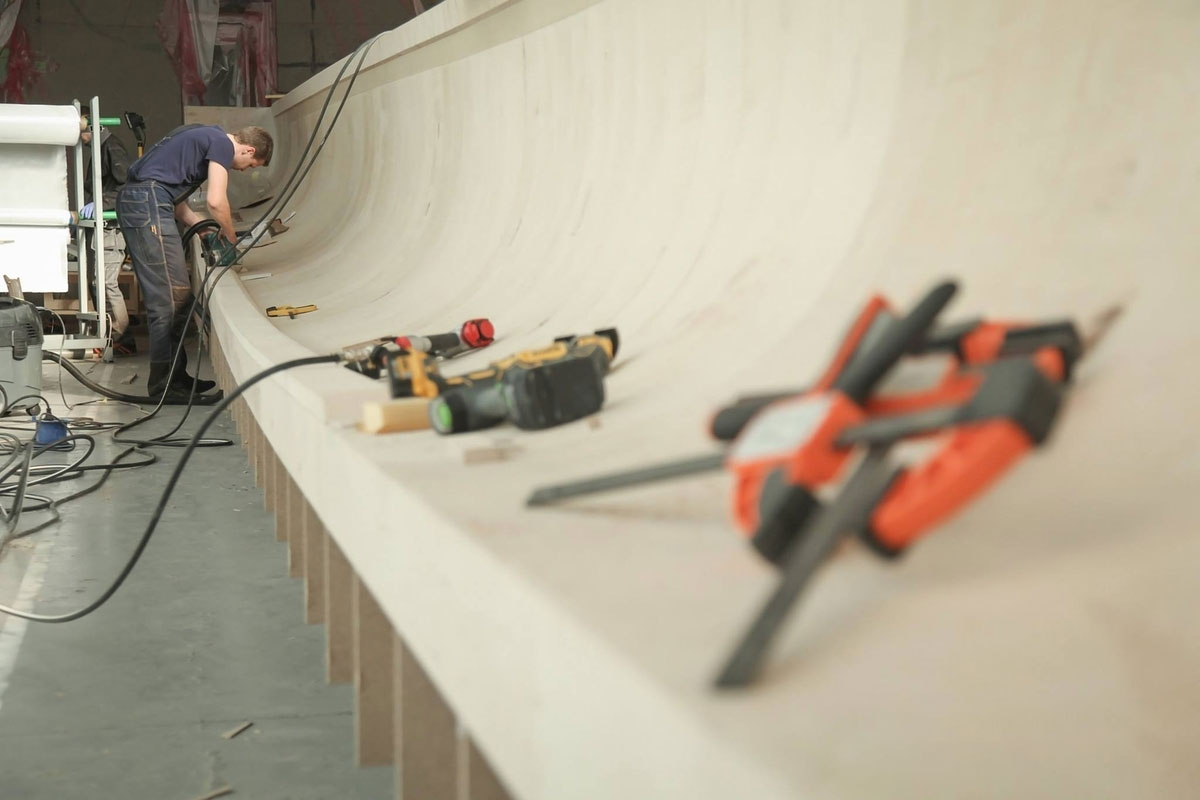 Latitude Yachts employee working on a yacht hull