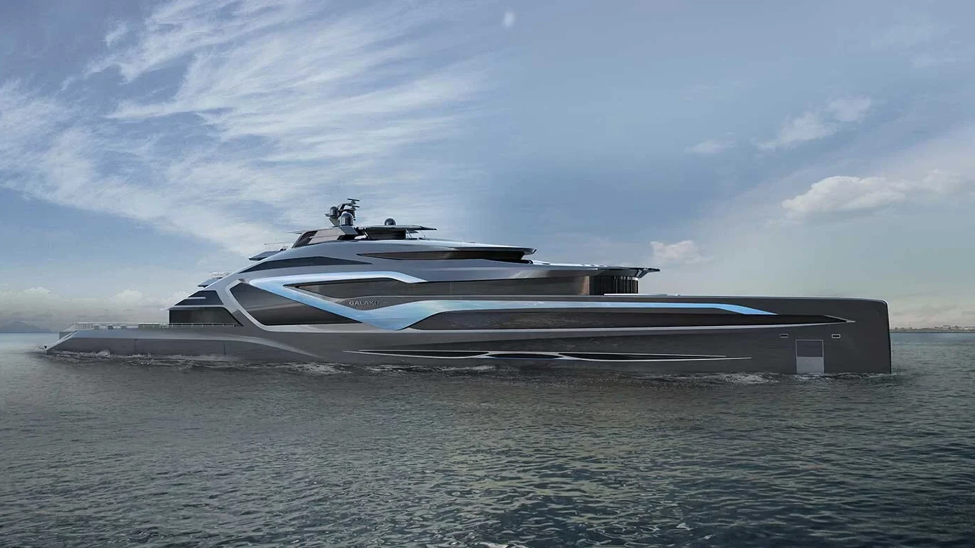 GALAXIA superyacht gliding near the coast emphasizing her elegant proportions and flowing design